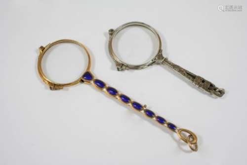 A PAIR OF GOLD AND ENAMEL PINCE-NEZ the handle with blue and white enamel and gold decoration, 14cm.