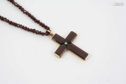 A VICTORIAN GARNET CRUCIFORM PENDANT AND NECKLACE the garnet cross set with a rose-cut diamond, in