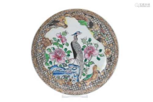A famille rose and encre de Chine porcelain deep dish, decorated with a bird and flowers.