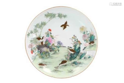 A polychrome porcelain deep charger, decorated with birds, flowers and bamboo. Marked with 6-