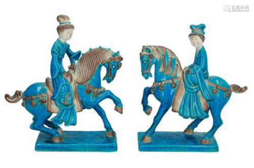A pair of turquoise ceramic sculptures of riders on horses. Marked with seal mark. China, approx.