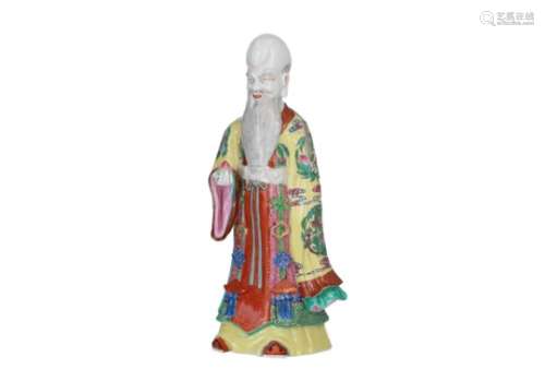 A polychrome porcelain sculpture of the god of longevity, holding a peach. Unmarked. China, 20th