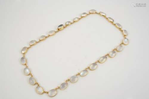 A MOONSTONE NECKLACE formed with graduated oval-shaped moonstones, collet set in gold, 43cm. long.