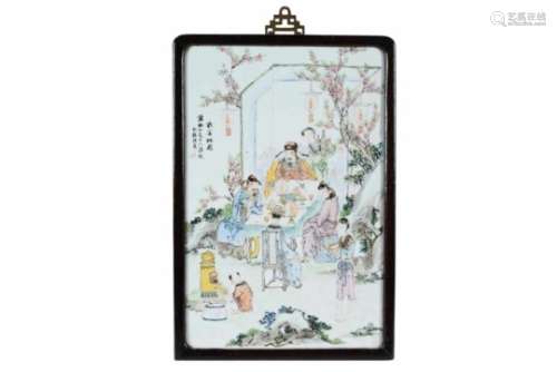 A polychrome porcelain plaque, decorated with figures in a garden. Signed. China, 19th century. Dim.