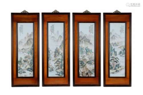 A set of four polychrome porcelain plaques in wooden frames, decorated with mountainous river