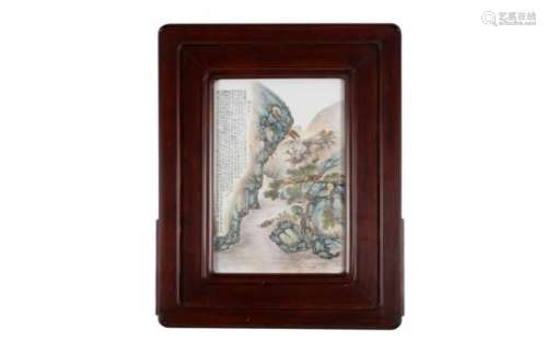 A polychrome porcelain plaque in wooden frame, depicting a mountainous river landscape. China,