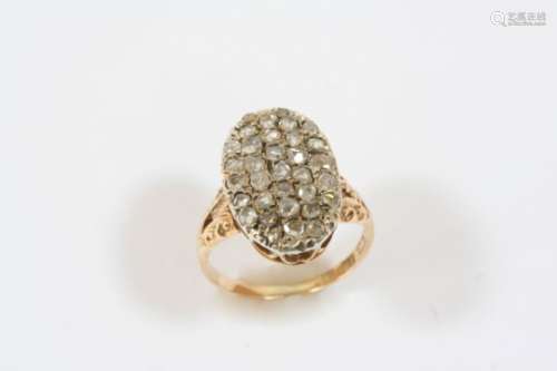 A DIAMOND CLUSTER RING the oval-shaped ring is set with rose-cut diamonds, in 15ct. gold. Size O.