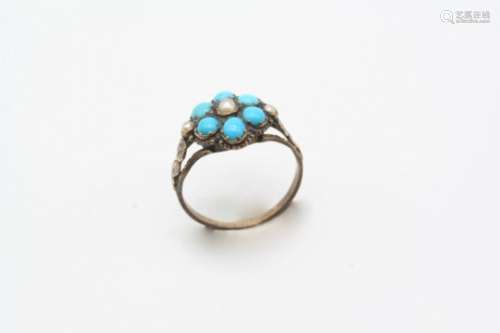 A VICTORIAN TURQUOISE AND HALF PEARL CLUSTER RING of flowerhead form, set with turquoise cabochons