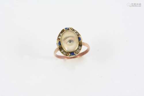 A VICTORIAN MINIATURE EYE RING the painted eye set within a suround of rose-cut diamonds and blue