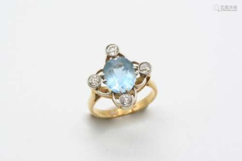 AN AQUAMARINE AND DIAMOND RING the oval-shaped aquamarine is set with four circular-cut diamonds