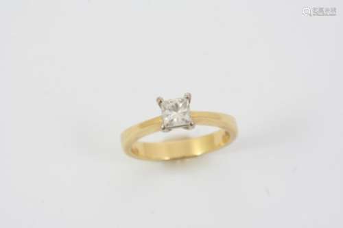 A DIAMOND SOLITAIRE RING set with a princess-cut diamond, in 18ct. gold. Size N.