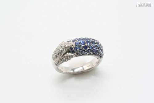 A SAPPHIRE AND DIAMOND RING the half hoop ring is mounted with one side with sections of circular-