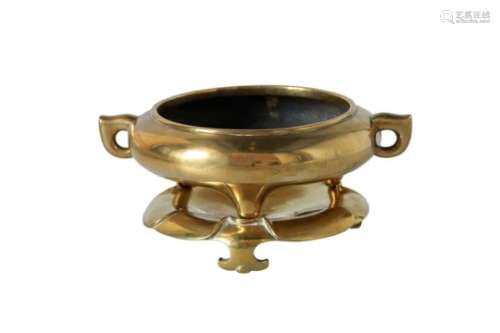 A bronze tripod censer with two handles, on bronze base. Marked with 6-character mark Xuande. China,