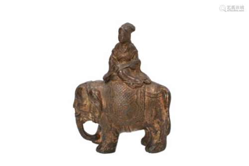 A gilded bronze musician riding an elephant. China, 19th century. Weight 775 g. H. 16,5 cm.