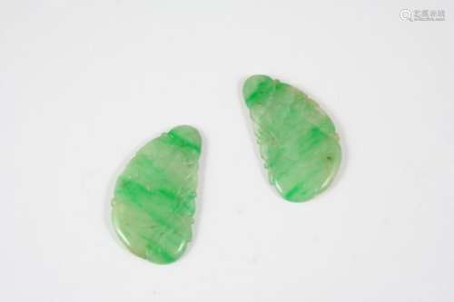 TWO PIERCED AND CARVED SECTIONS OF JADE with foliate carved decoration, each 3.5cm. long.