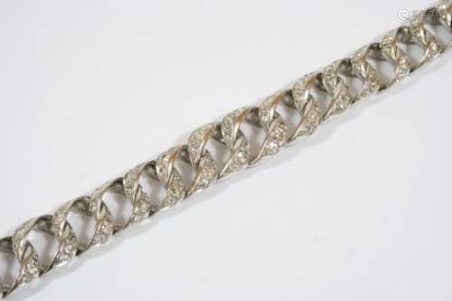 A HEAVY 18CT. WHITE GOLD AND DIAMOND BRACELET the graduated overlapping links are mounted with