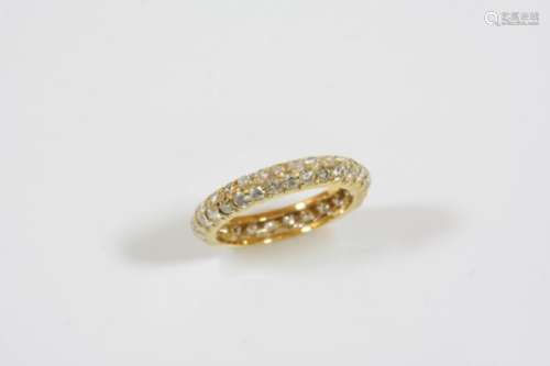 A DIAMOND FULL CIRCLE ETERNITY RING BY VAN CLEEF & ARPELS mounted with two rows of circular-cut
