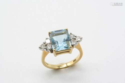 AN AQUAMARINE AND DIAMOND RING the rectangular-shaped aquamarine is set with three circular-cut