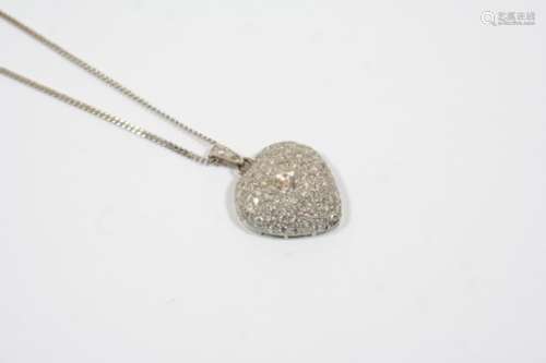 A DIAMOND HEART-SHAPED PENDANT centred with a brilliant-cut diamond and overall with circular-cut