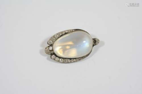 A MOONSTONE AND DIAMOND BROOCH the oval-shaped moonstone is set within a surround of graduated old