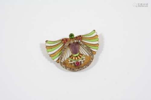 A VICTORIAN EGYPTIAN REVIVAL ENAMEL AND GEM SET BROOCH the central figure with carved amethyst face,