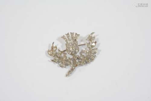 A DIAMOND THISTLE BROOCH set overall with graduated cushion-shaped and rose-cut diamonds, 4cm.