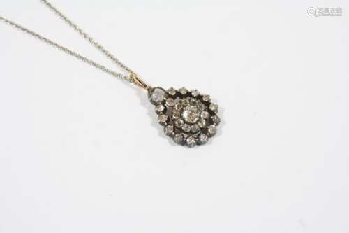 A VICTORIAN DIAMOND CLUSTER PENDANT the central flowerhead diamond cluster is suspended with a