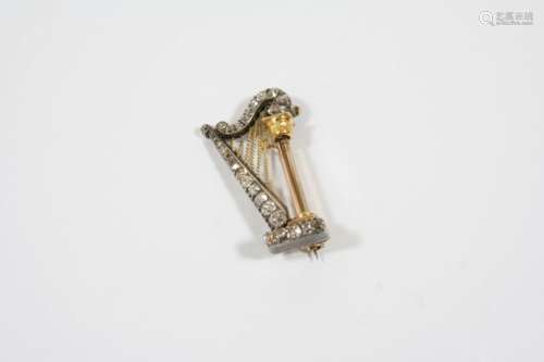 A VICTORIAN DIAMOND HARP BROOCH mounted with graduated old brilliant-cut diamonds, set in silver and