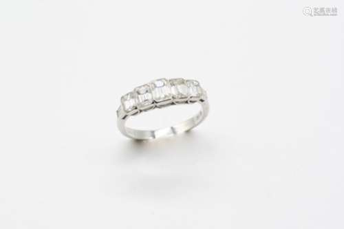A DIAMOND FIVE STONE RING the five graduated emerald-cut diamonds are set in 18ct. white gold.