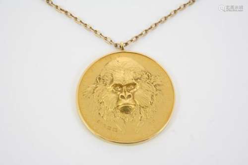 GERALD BENNEY AND DAVID WYNNE A 22ct. gold 'Wild Life' medallion, in a pendant mount, of circular