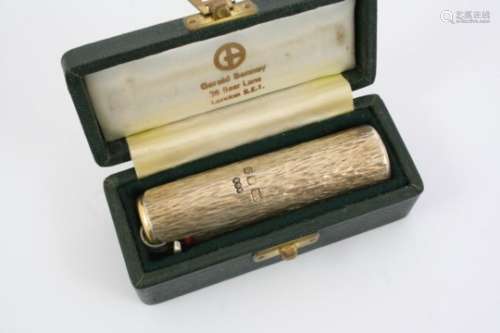 A 20TH CENTURY SILVER GILT CIGARETTE LIGHTER HOLDER BY GERALD BENNEY with textured cylindrical body,