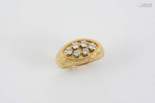 A DIAMOND AND GOLD RING BY GERALD BENNEY the 18ct. gold mount with engraved swirl decoration and set