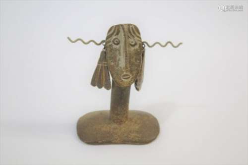 JOHN MALTBY (BORN 1936) a stoneware figure with hanging adornments, supported on a column and flat