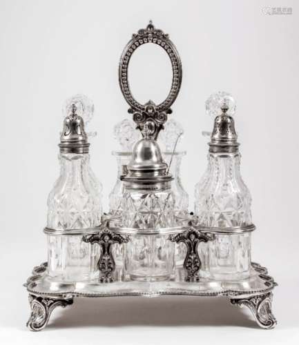 A Victorian silver rectangular seven-division cruet stand of shaped outline with reeded and bead