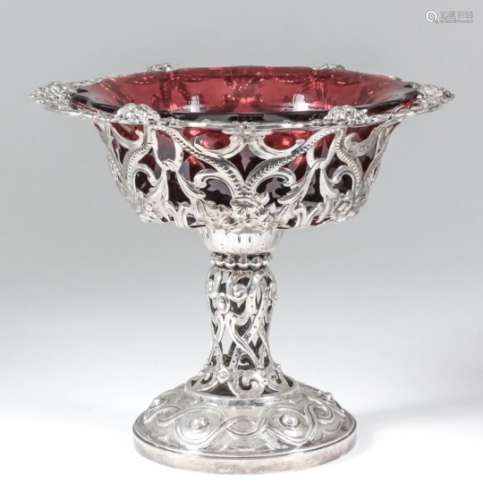 A Victorian silver circular tazza, the shaped and moulded rim cast with floral sprays and ribbons,