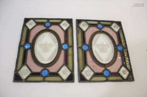 PAIR OF STAIN GLASS PANELS each panel with a crown motif in the centre on clear glass, each corner