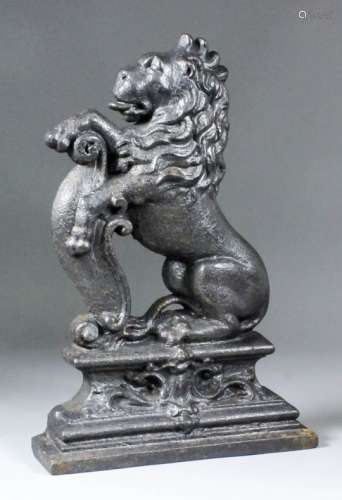 A late 19th / early 20th Century cast iron door stop in the form of an heraldic lion, on moulded