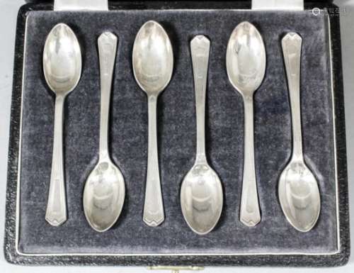 A set of six George VI silver coffee spoons with reeded handles and shaped terminals, by Walker &