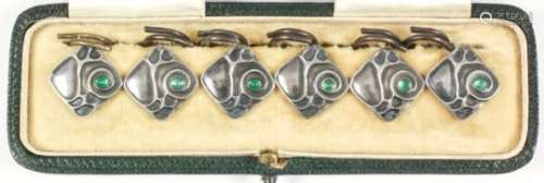A set of six early 20th Century silvery metal square buttons, each set with a green chalcedony