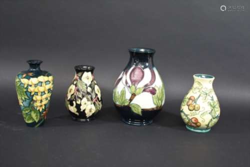 MOORCROFT VASES 4 various vases including a modern vase in the Wisteria design, made for the