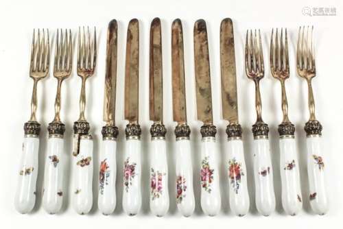 A set of six Continental gilt metal and porcelain handled fruit knives and forks, the handles