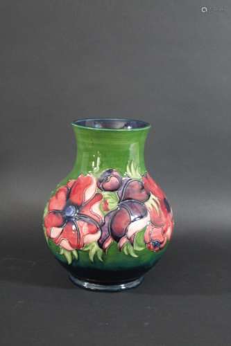 MOORCROFT VASE - ANEMONE a large vase painted in the Anemone design on a green ground. Marked,