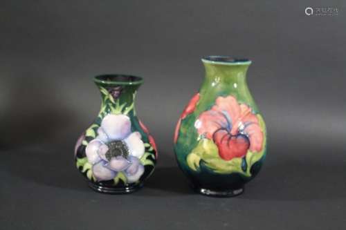 MOORCROFT VASE a circa 1920's/30's vase in the Hibiscus design, the flowers painted on a green