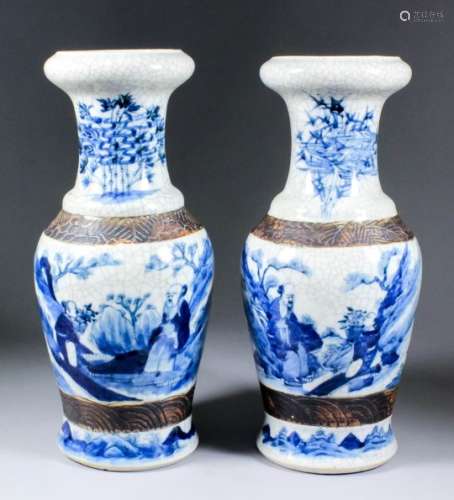 A pair of Chinese blue and white porcelain vases painted with seated figures in a landscape, 13.