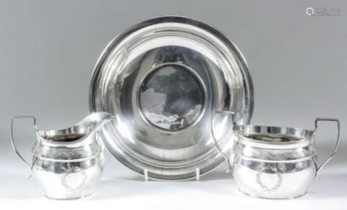 An Elizabeth II silver oval two-handled sugar basin with reeded mounts, engraved with a band of