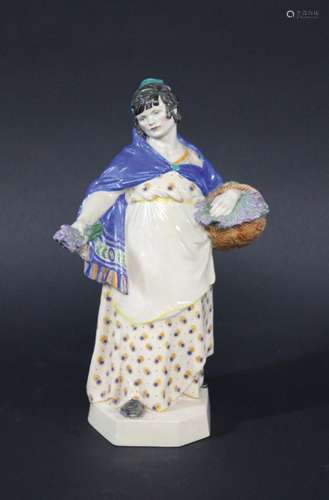 CHARLES VYSE (1882-1971) CHELSEA POTTERY FIGURE of The Lavender Girl, the figure holding a basket of