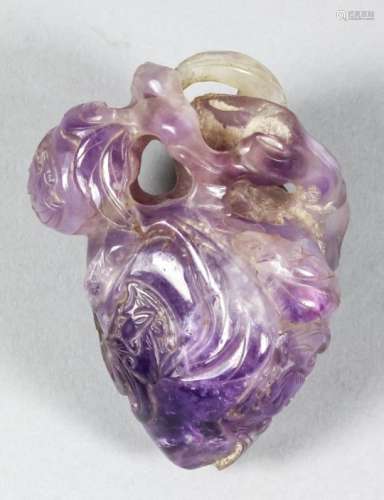 A Chinese amethyst carving of a two peaches and five bats, 3ins (7.6cm) overall