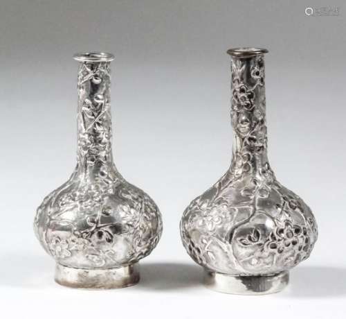 A pair of Chinese silver miniature bottle vases chased and cast with prunus blossoms, 2.75ins (