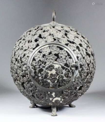 An early 19th Century Japanese bronze spherical birdcage cast and pierced with prunus blossom with