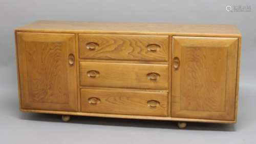 ERCOL SIDEBOARD a large light elm sideboard with 3 central drawers (one with cutlery compartment),